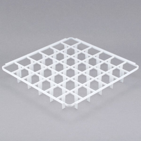 A white plastic grid with many small compartments.