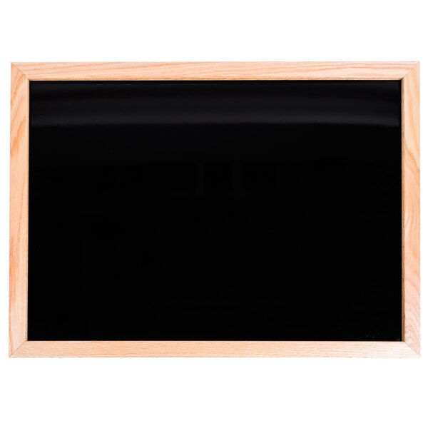 An oak-framed black marker board.