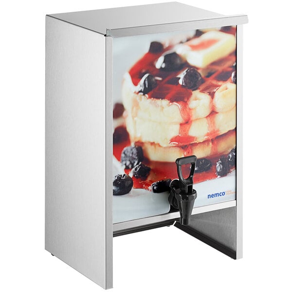 A silver metal Nemco batter dispenser with a picture of pancakes and berries.
