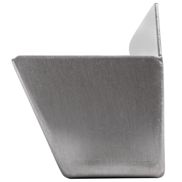 A close-up of a silver metal container with a handle.