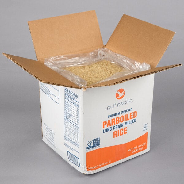 A box of Gulf Pacific Parboiled White Rice with a package inside.