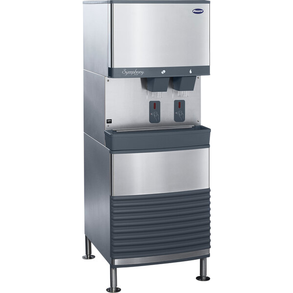 A stainless steel rectangular Follett ice machine and water dispenser with two dispensers.