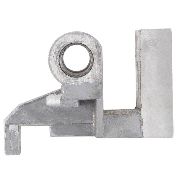 A close-up of a metal Avantco towing bracket with a hole in it.
