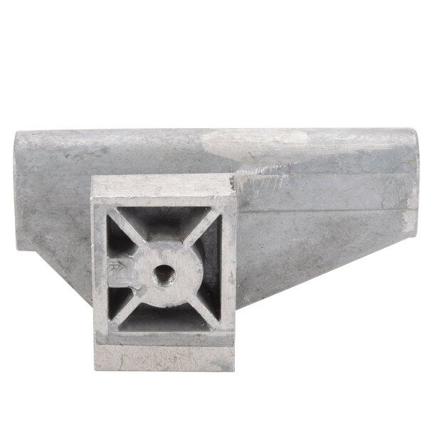 A close-up of a metal Avantco towing bracket with a square hole in it.