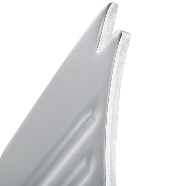 A close-up of a metal regulator plate for an Avantco meat slicer.