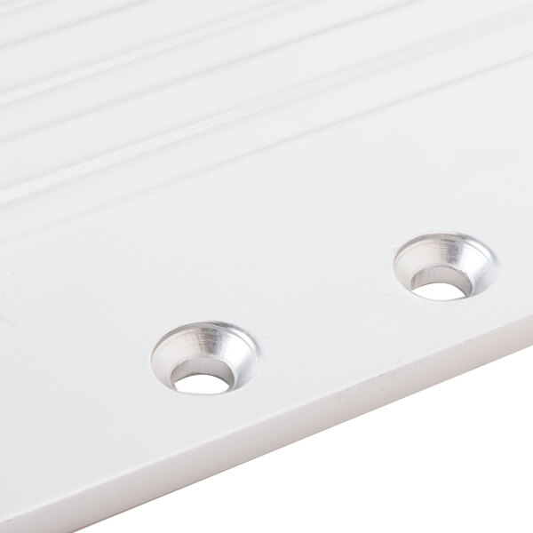 A white plastic Avantco regulator plate with two holes.