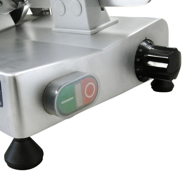 A close-up of a metal Avantco meat slicer with a button on it.