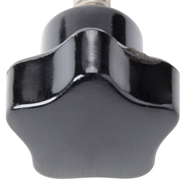 A black plastic knob with a star-shaped metal screw.