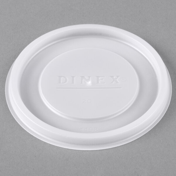 A Dinex translucent plastic lid with text.