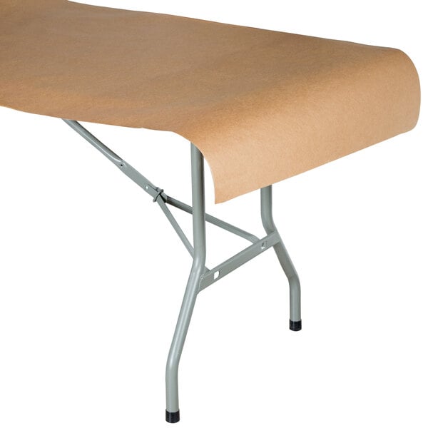 A folding table with Choice brown paper on top.