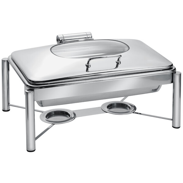 An Eastern Tabletop stainless steel rectangular chafer with a glass lid on a stand.