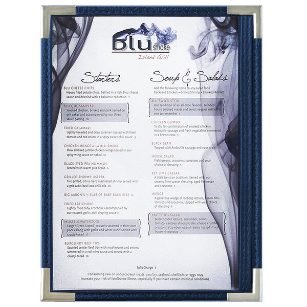 A Royal blue Menu Solutions menu board with silver corners on a table with a menu displayed.