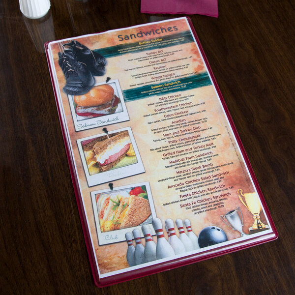 A Menu Solutions cherry wood menu board on a table.