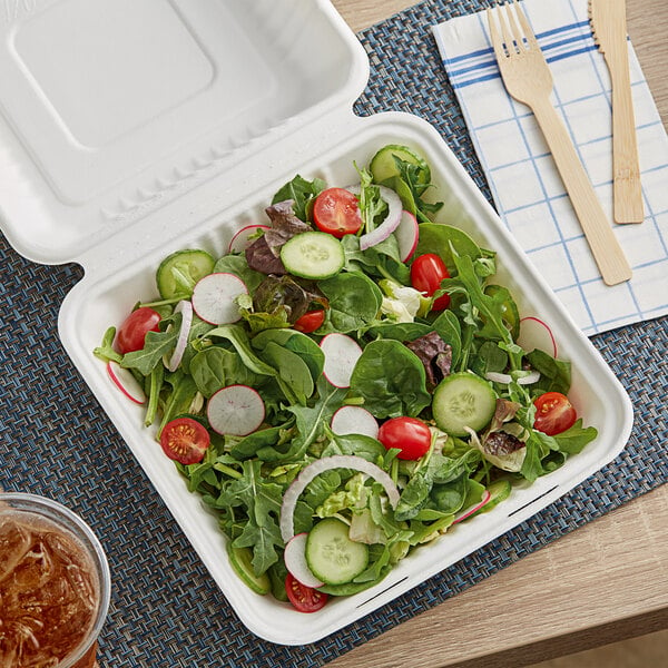 A salad in a white EcoChoice compostable take-out box.