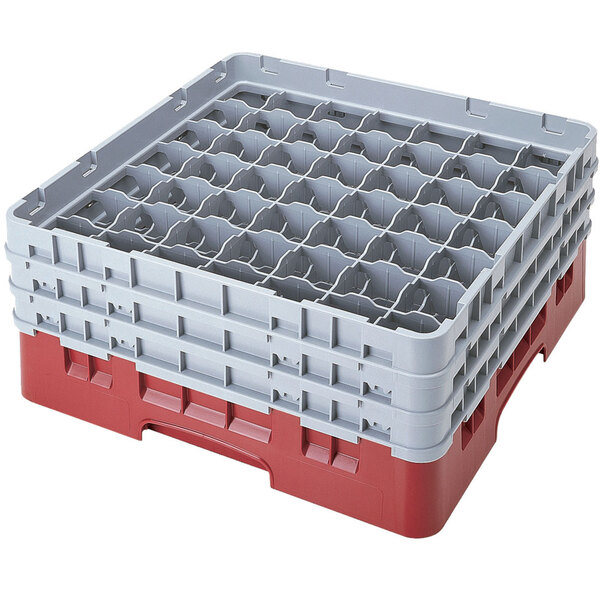 A stack of red and gray Cambro plastic glass racks with six compartments.