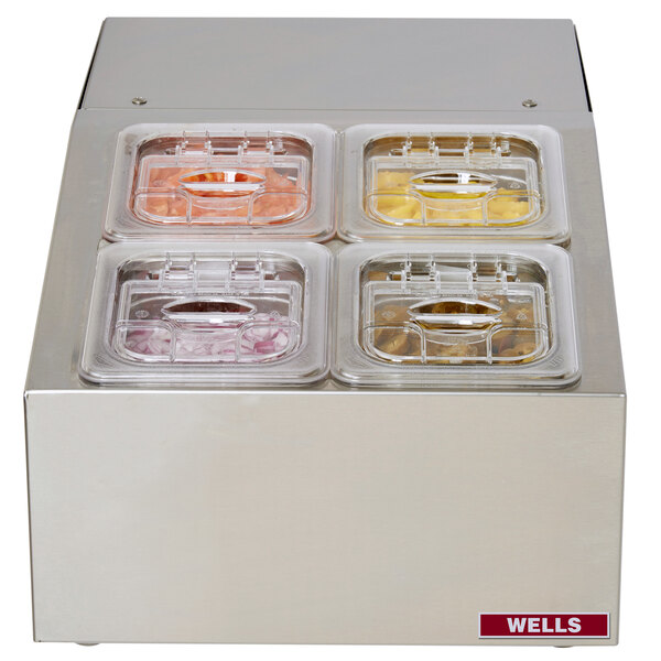 A Wells refrigerated countertop server with four food pans inside.