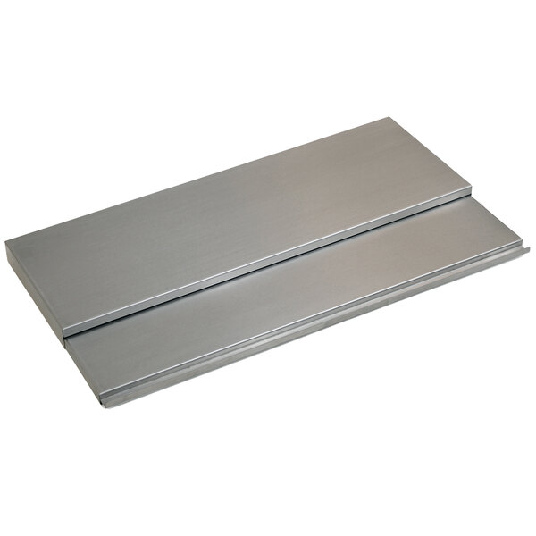 A silver rectangular metal cover for an Eagle Group Spec-Bar ice chest on a counter.