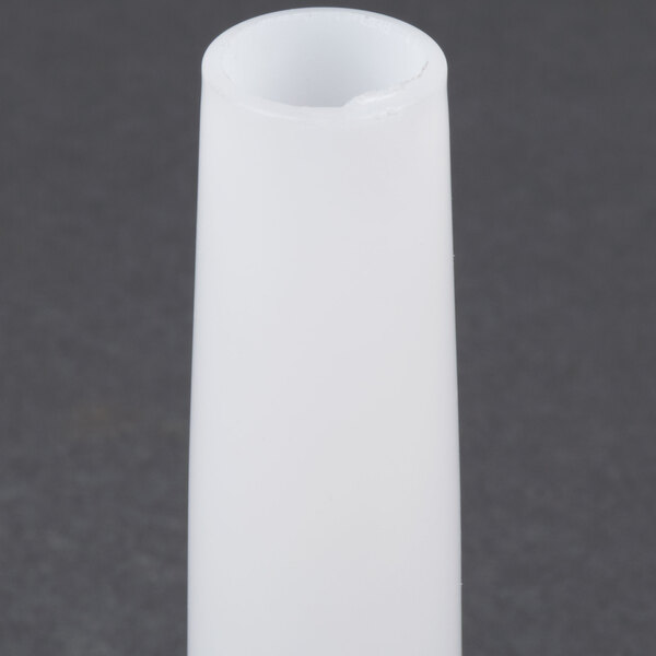 A white cylindrical sausage stuffer tube with a small hole in it.