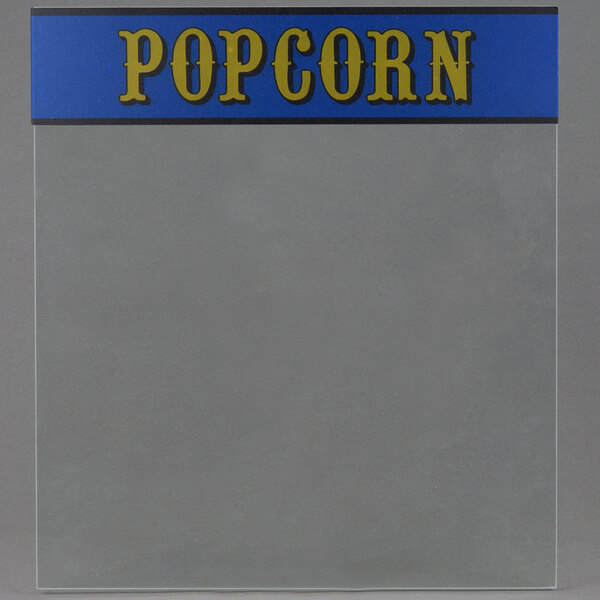 Clear glass side for a Paragon popcorn popper with blue and yellow text that says "popcorn"