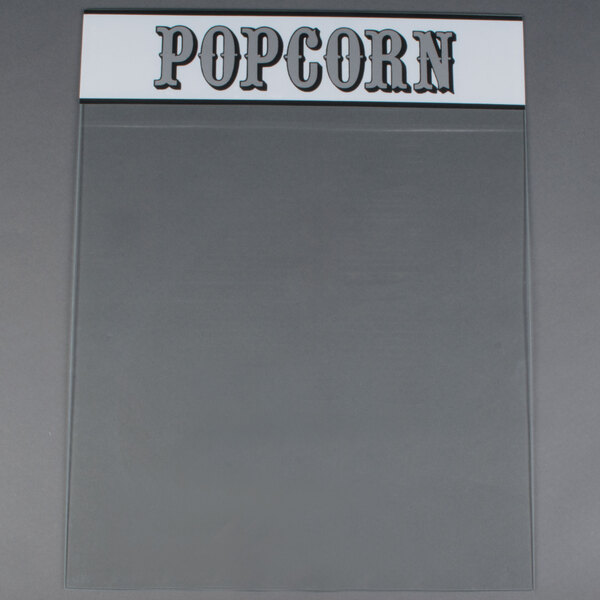 A clear plastic panel with the word "popcorn" in white.