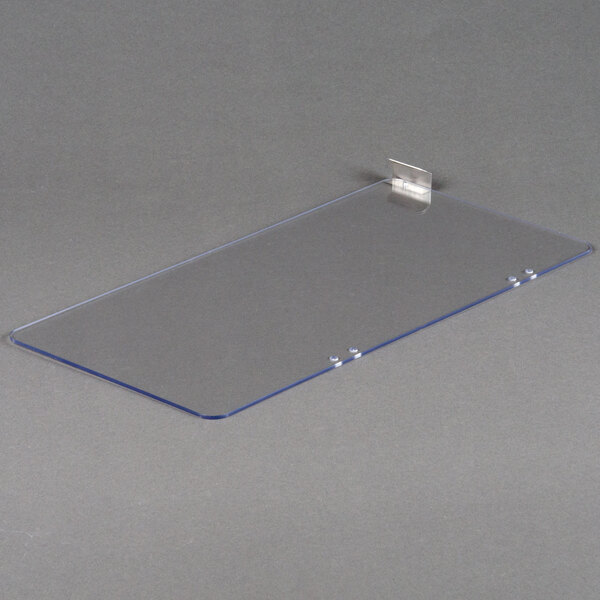 A clear plastic plate with a metal holder.