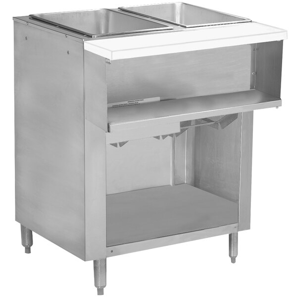 A stainless steel Advance Tabco wetbath hot food table with two open wells on top of an enclosed shelf.
