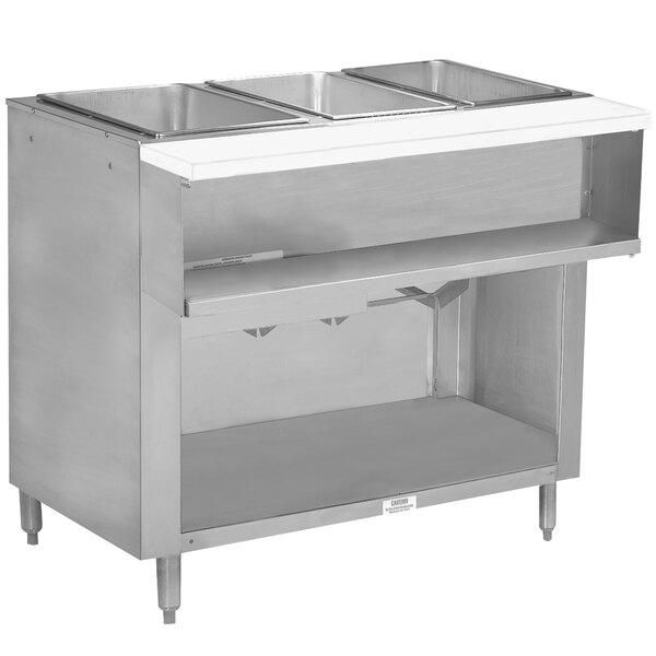 A stainless steel Advance Tabco liquid propane hot food table with an enclosed shelf.