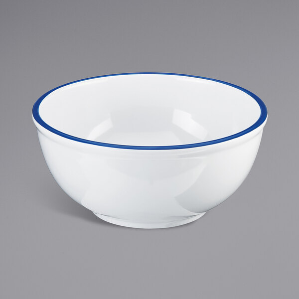 A white melamine bowl with a blue rim.
