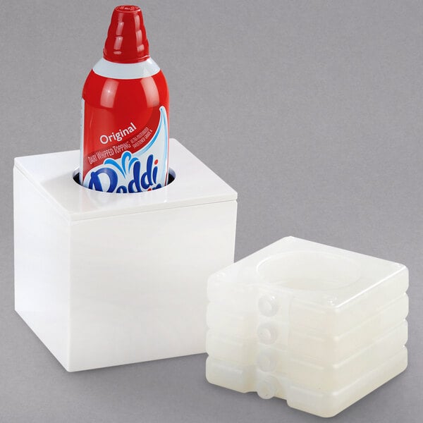 A white Cal-Mil box with a red bottle inside.