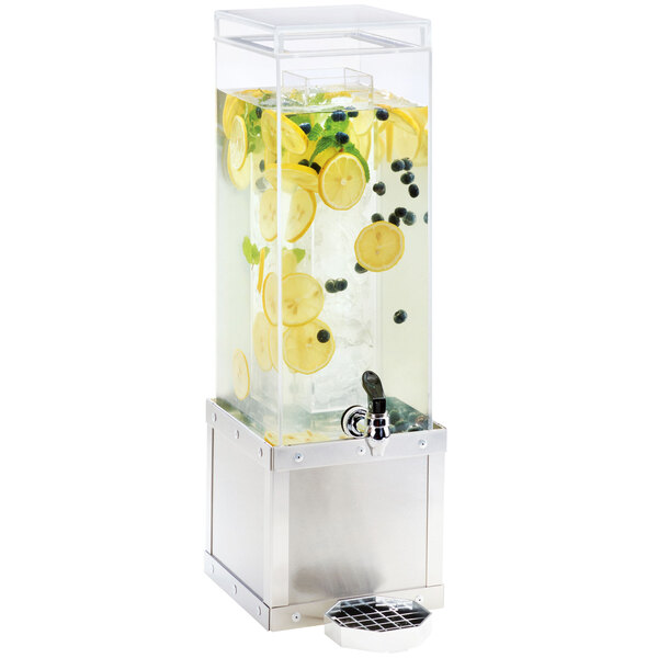 A Cal-Mil stainless steel beverage dispenser with lemon slices and blueberries in the water.