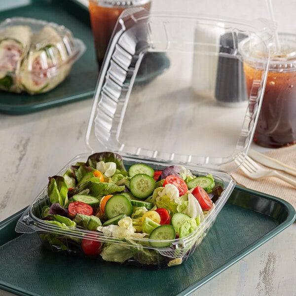 A salad in a Dart clear plastic hinged container.