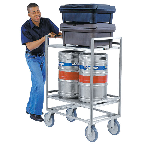 A man pushing a Lakeside stainless steel utility cart with beer kegs.