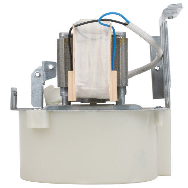 A white circular fan motor with wires.