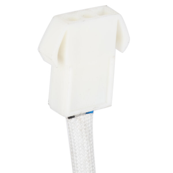 A white cable with a white connector on a Solwave fan motor.