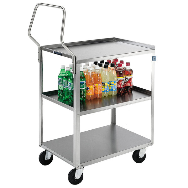 A Lakeside stainless steel utility cart with shelves holding bottles of soda.