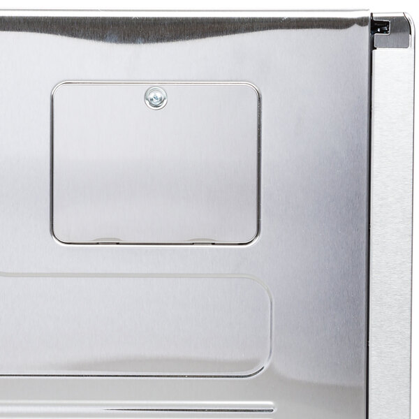 A close up of a stainless steel Solwave light bulb access cover.