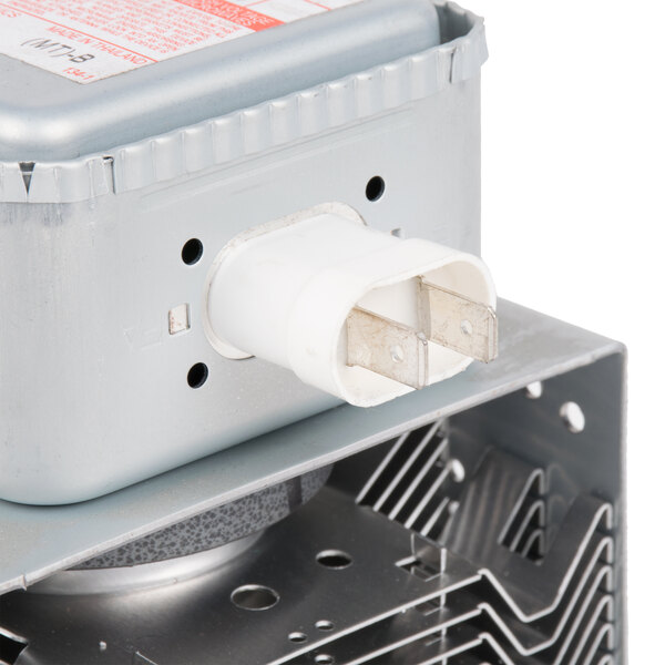 A close up of a Solwave Magnetron with a power cord.