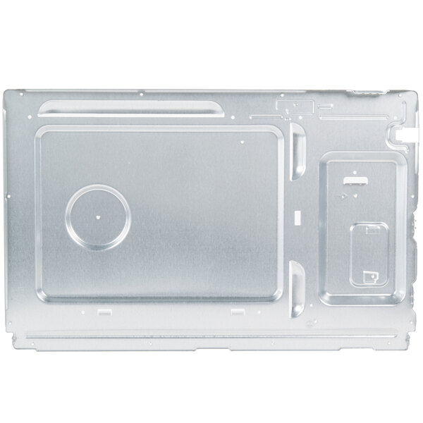 A close-up of a metal plate with a small hole in it.