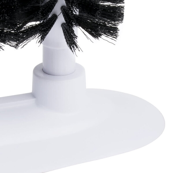 A close-up of a brush with white bristles.