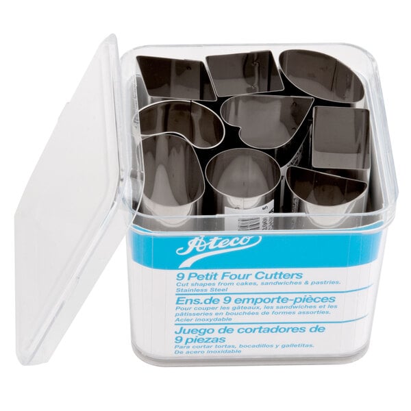 A silver container of Ateco stainless steel petit four cutters.