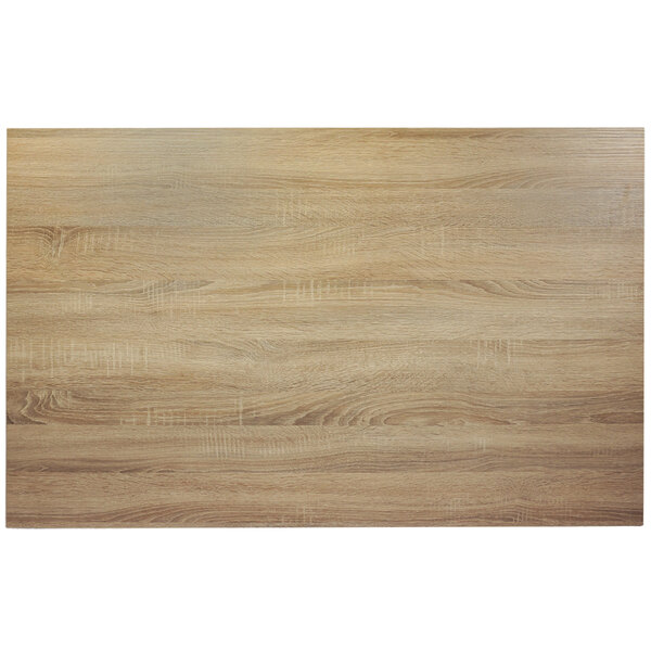 A BFM Seating rectangular table top with a sawmill oak finish.