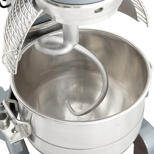 A large metal spiral dough hook with a spiral handle.