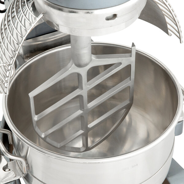 A close up of an Avantco mixer with a metal flat beater inside a metal bowl.