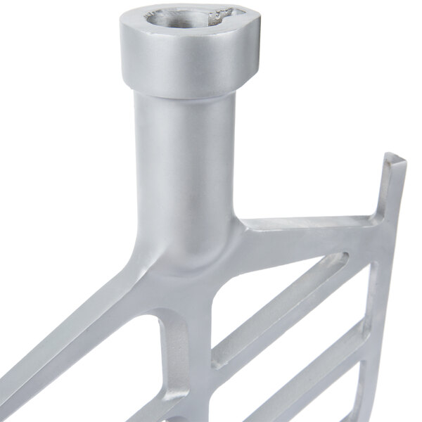 A close-up of a silver metal Avantco flat beater.