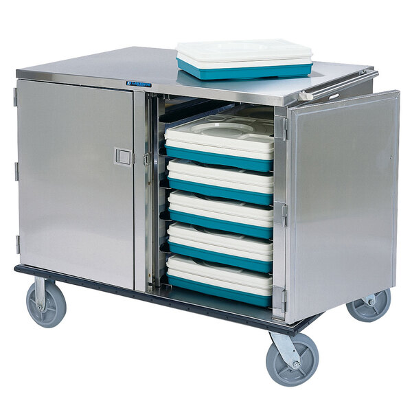 A Lakeside stainless steel tray cart filled with trays.