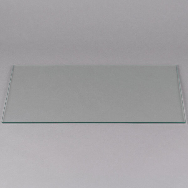 A rectangular glass plate with a black border on a white surface.