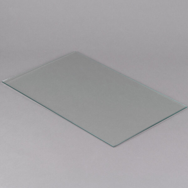 An Avantco glass panel on a white surface.