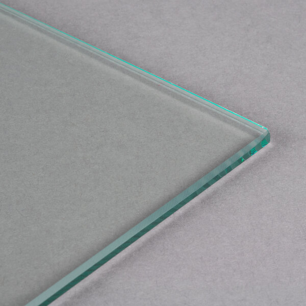 A clear glass surface with a thin green edge.