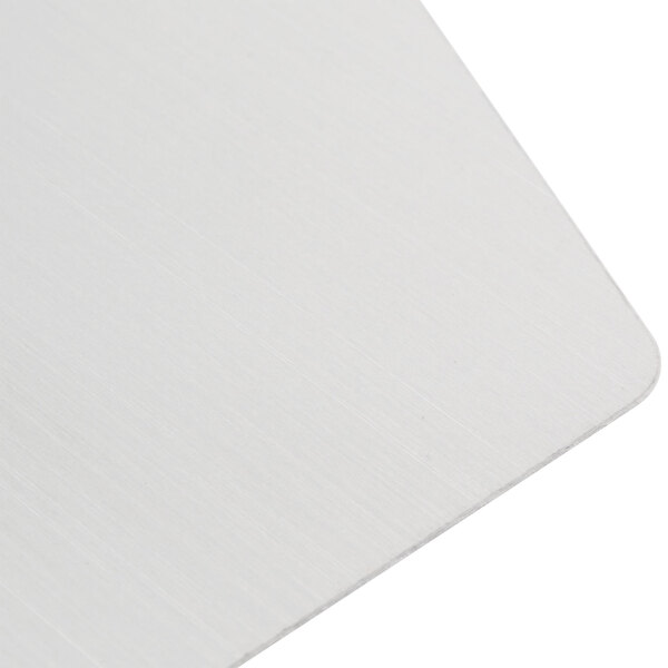 A white metal separation plate with a silver edge.