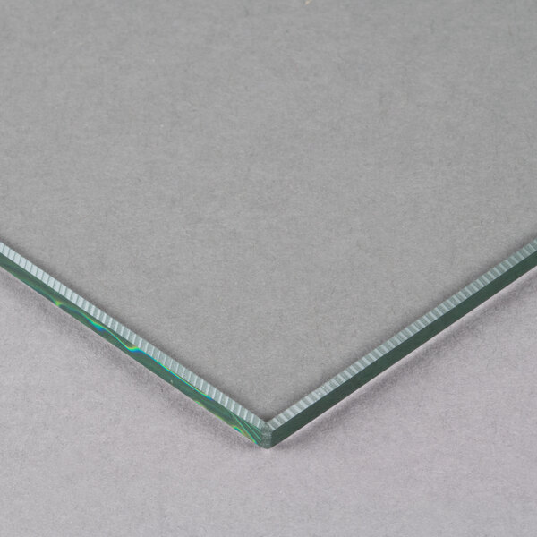 A close-up of a corner of an Avantco glass panel.